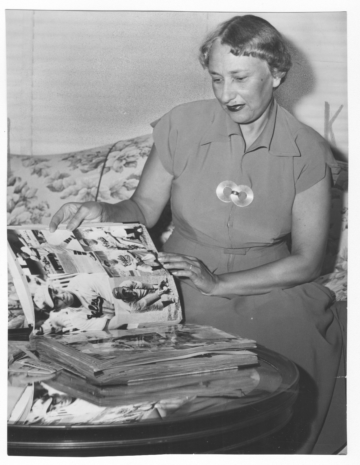 Effa Manley reviewing her scrapbook of Newark Eagles clippings, 1950