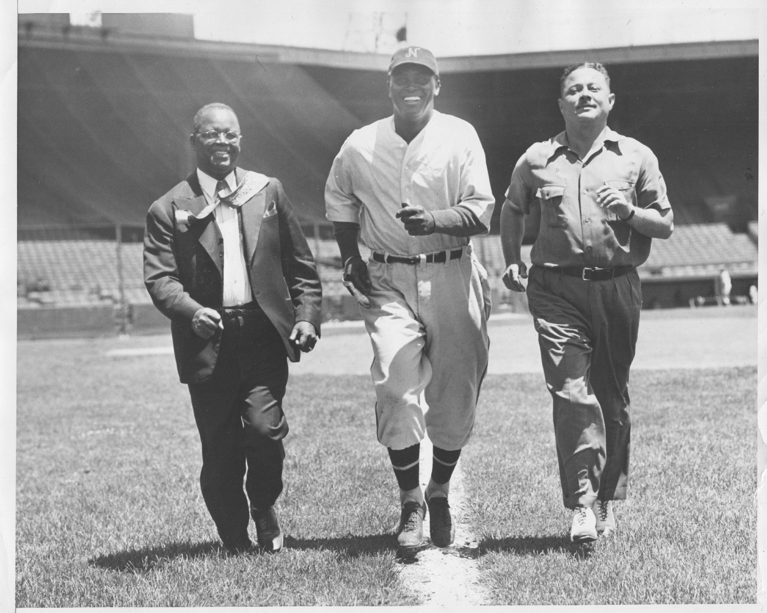 Abraham Manley and players on the field at Ruppert Stadium, Newark